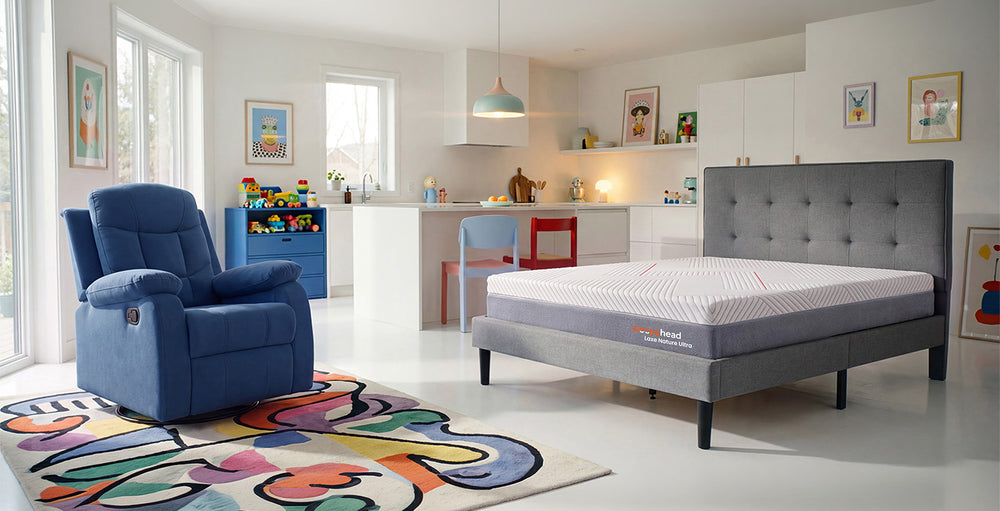 Modern Living room with colorful walls, Recliner, and Mattress.